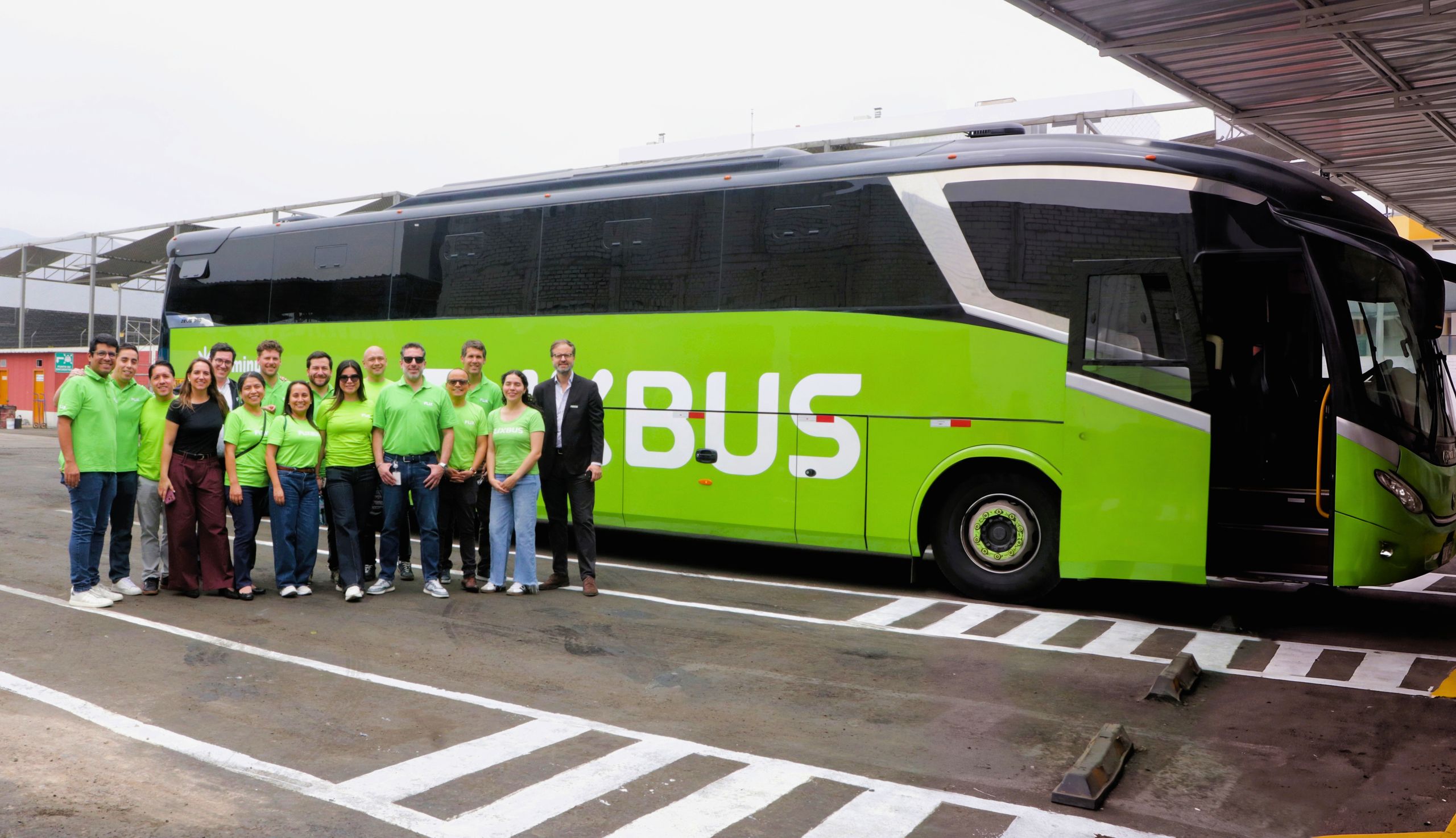 FlixBus Peru team in front of the green FlixBus coach.